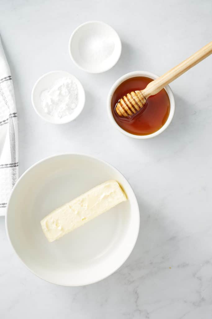 ingredients for honey butter on white background