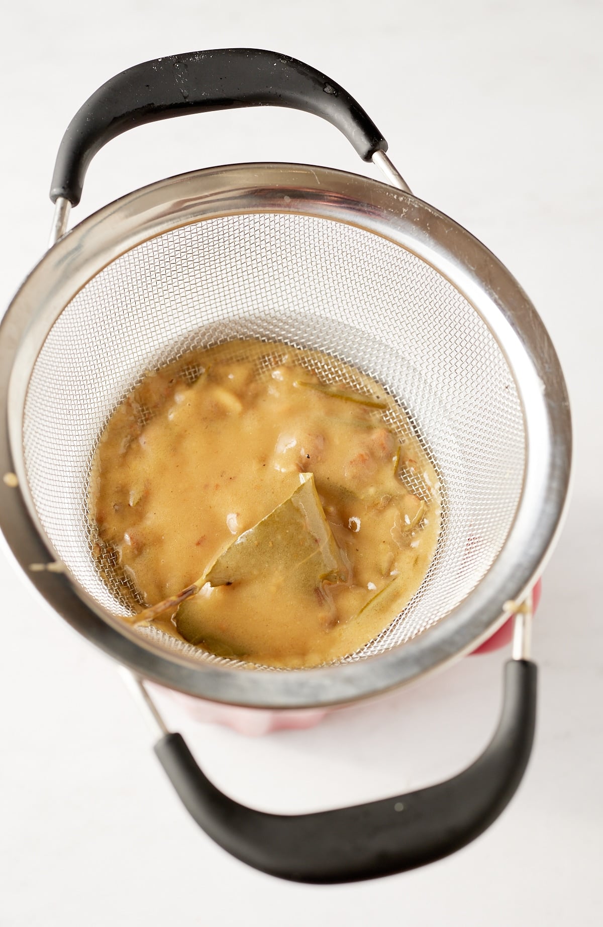 gravy being strained