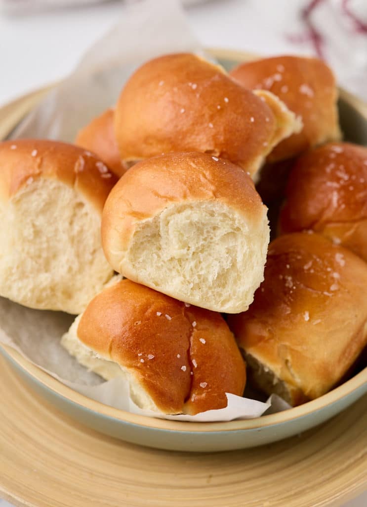 Air fryer dinner rolls served in a large bowl.