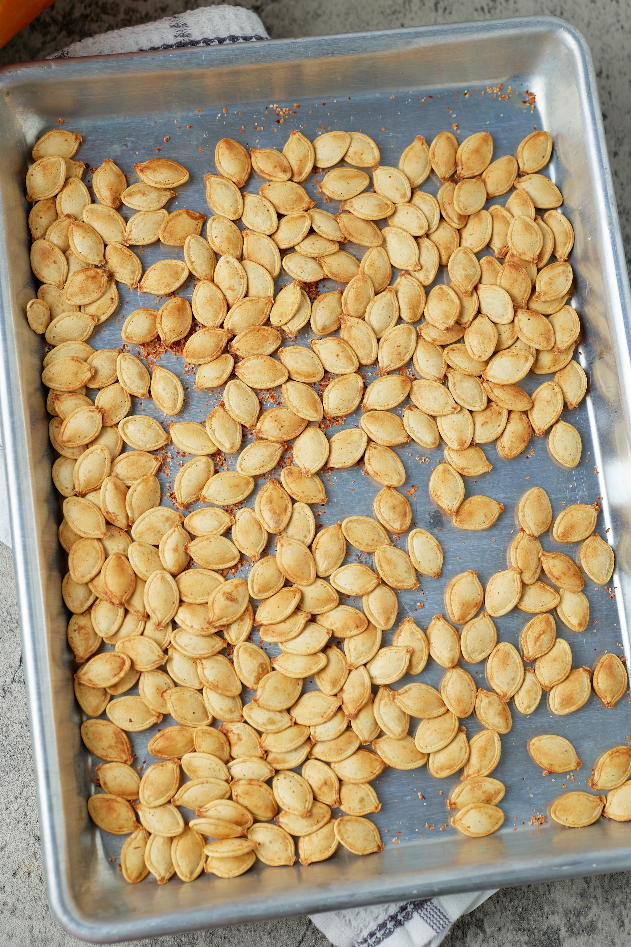 pumpkin seeds on sheet pan