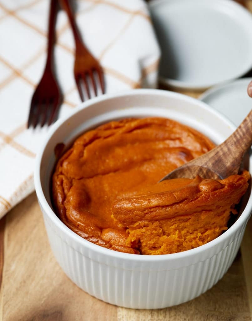 A wooden spoon serving the souffle.