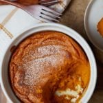 A carrot souffle topped with powdered sugar.