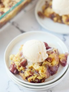 A scoop of ice cream on top of the dump cake.