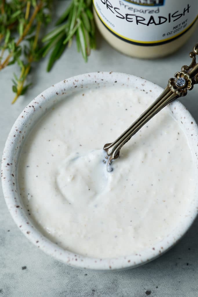 Overhead shot of a bowl of homemade horseradish sauce.