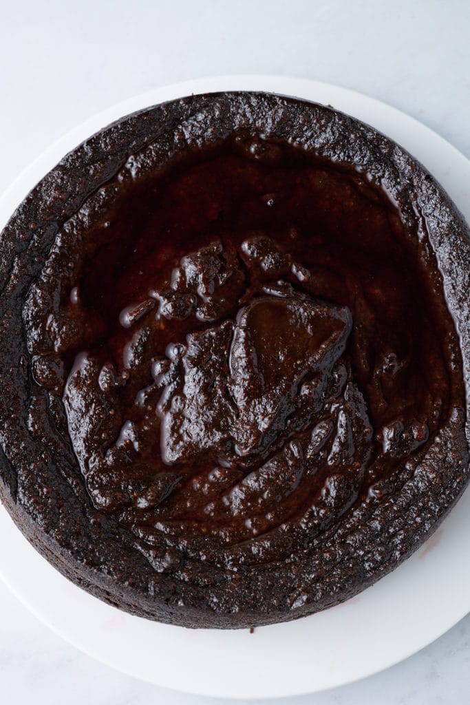 wine poured over jamaican black cake before absorbing