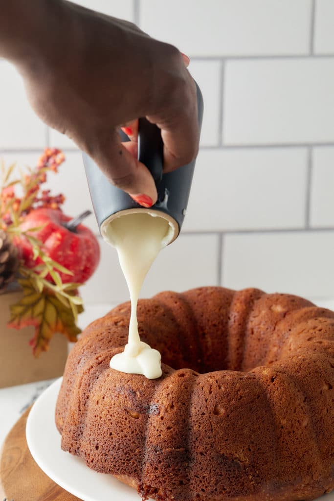 Glazing the cake.