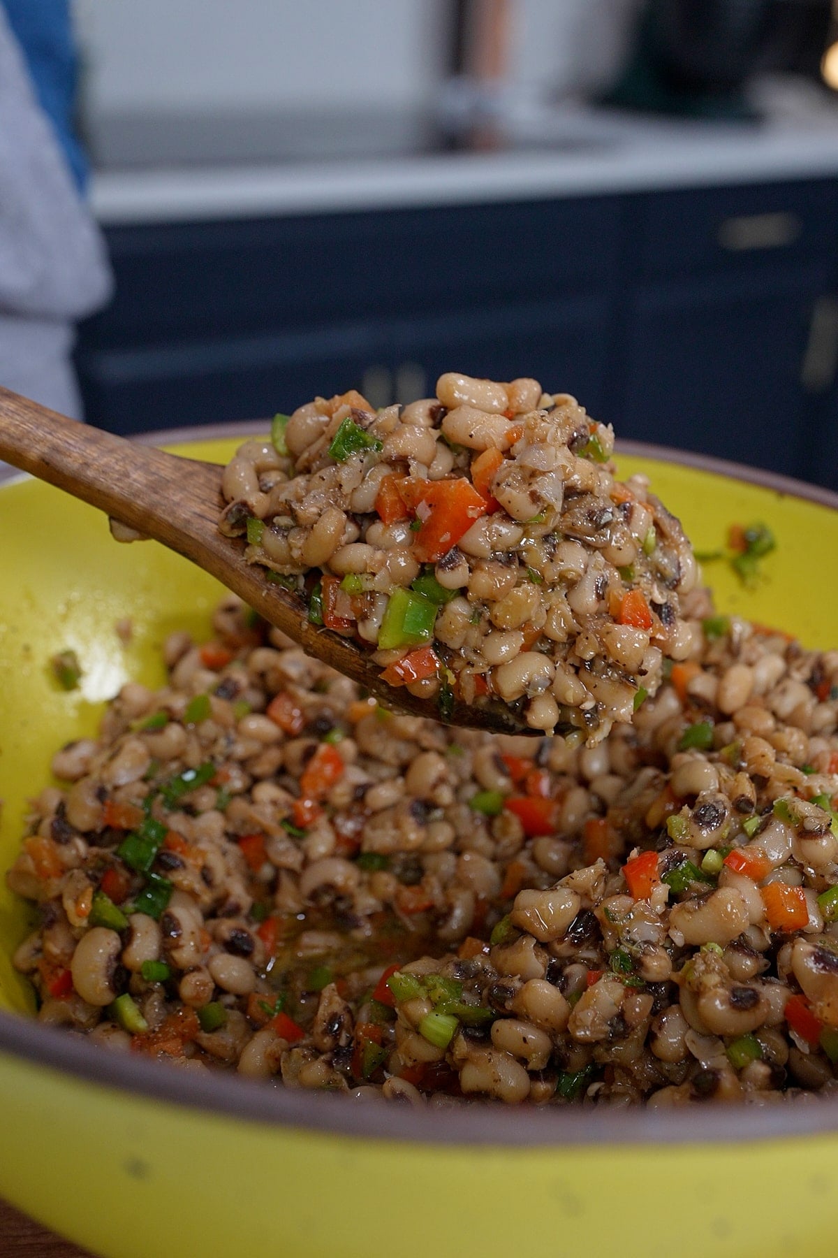spoon holding black eye pea salad