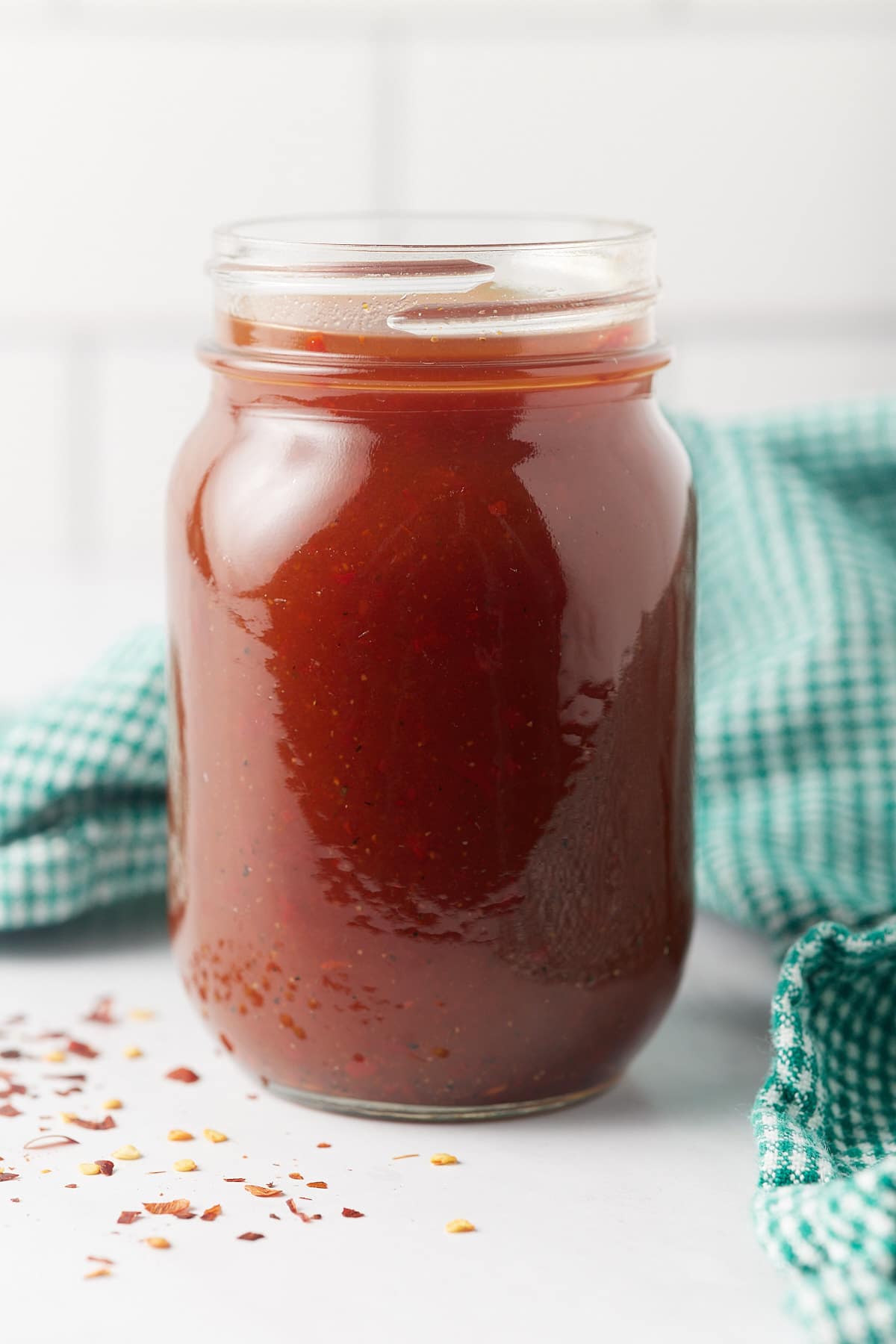 Vinegar BBQ sauce in a glass jar.