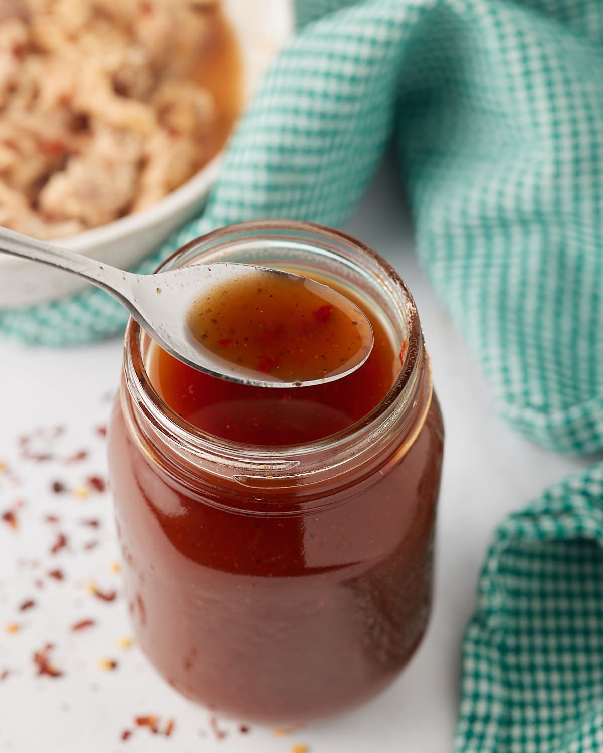 Vinegar BBQ sauce on a spoon.