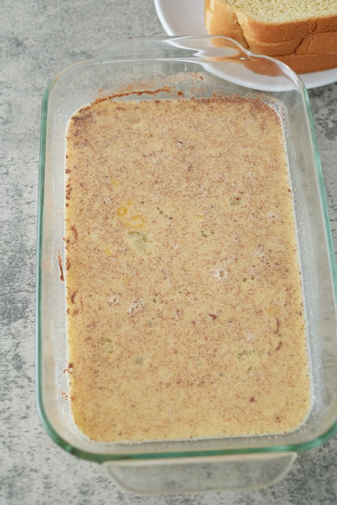 The French toast batter in a large dish.