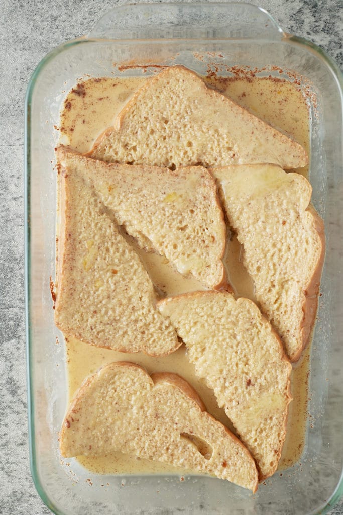 Slices of bread soaking in the egg mix.