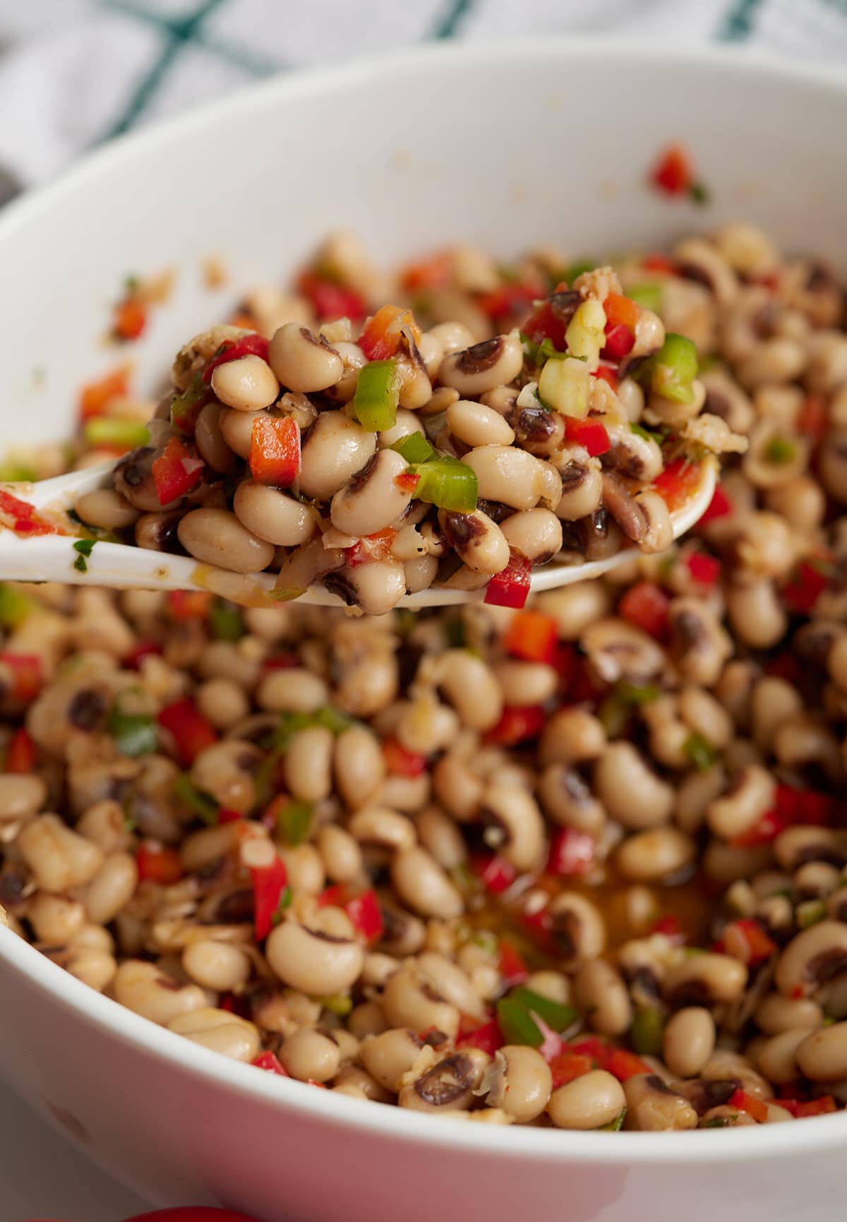 Black eyed pea salad on a spoon.