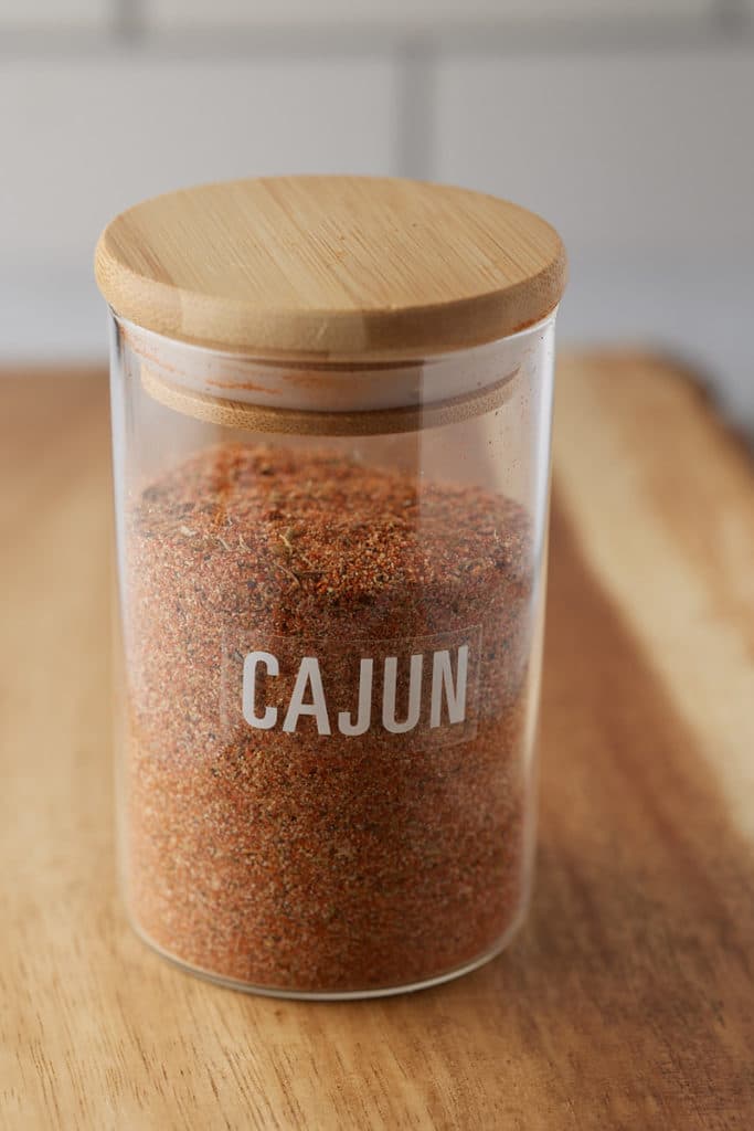 A storage jar holding the Cajun seasoning.