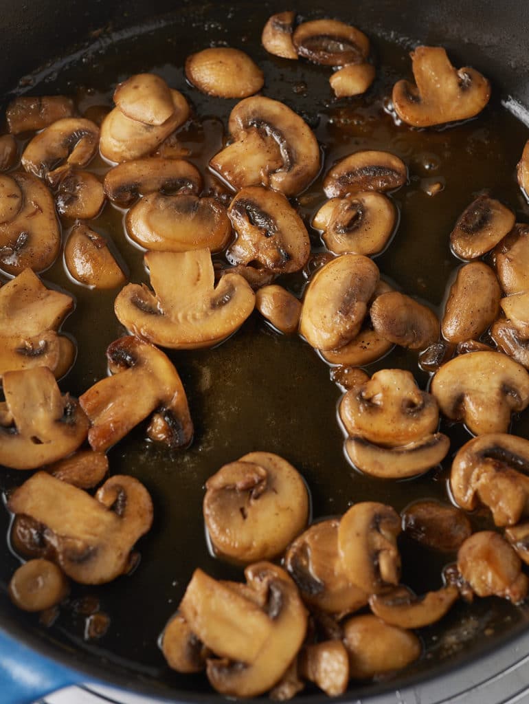 Cooked mushrooms in a skillet.