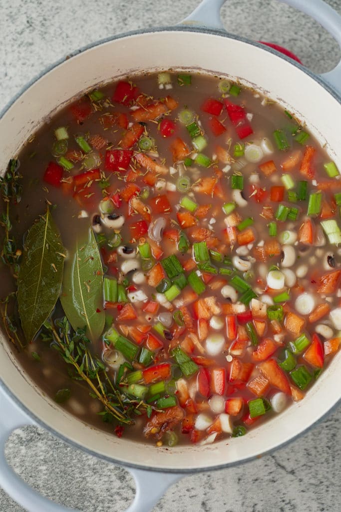 Vegetables and seasonings added to the pot of blackeye peas.