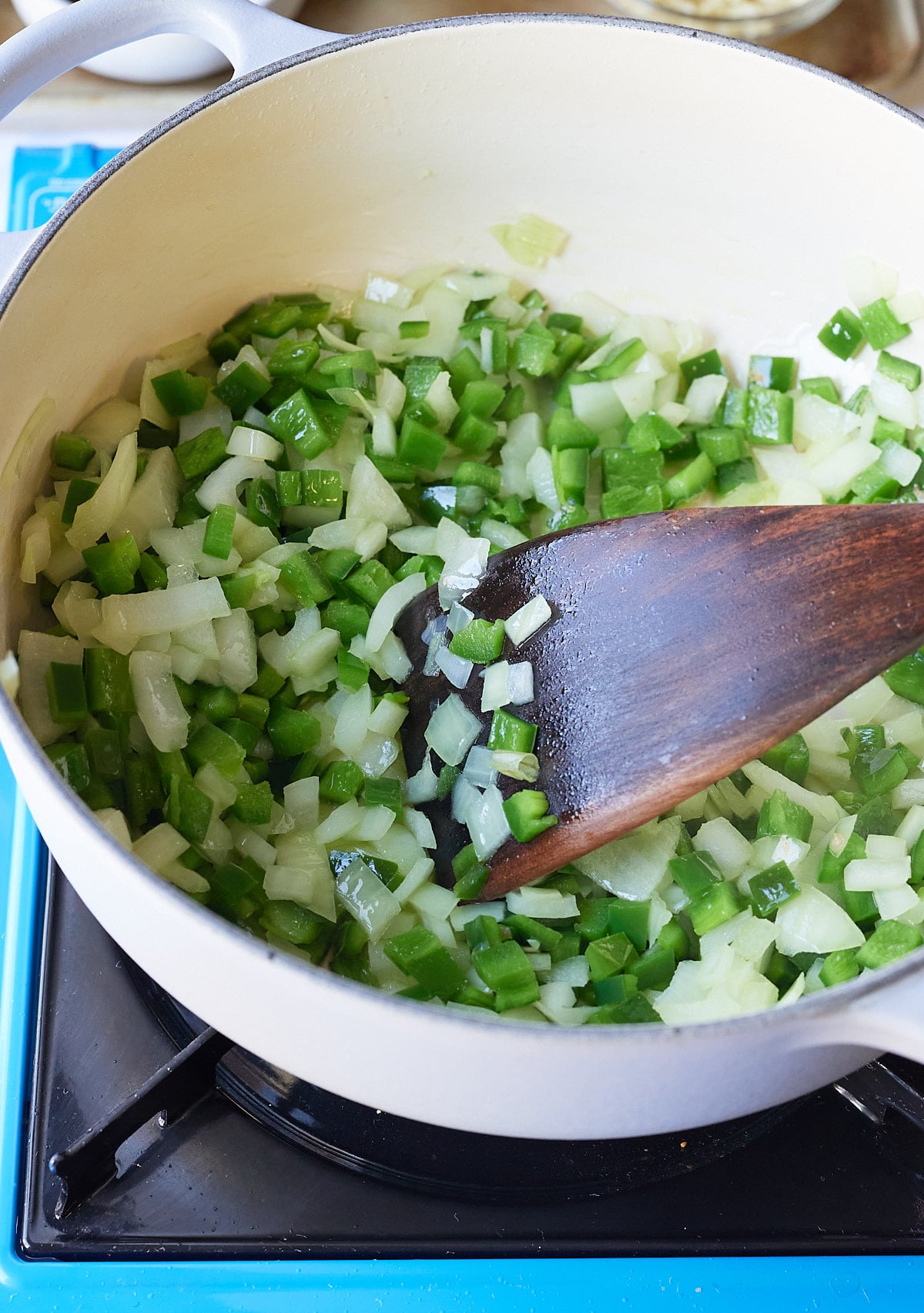 sauteéing onions and peppers in large pot