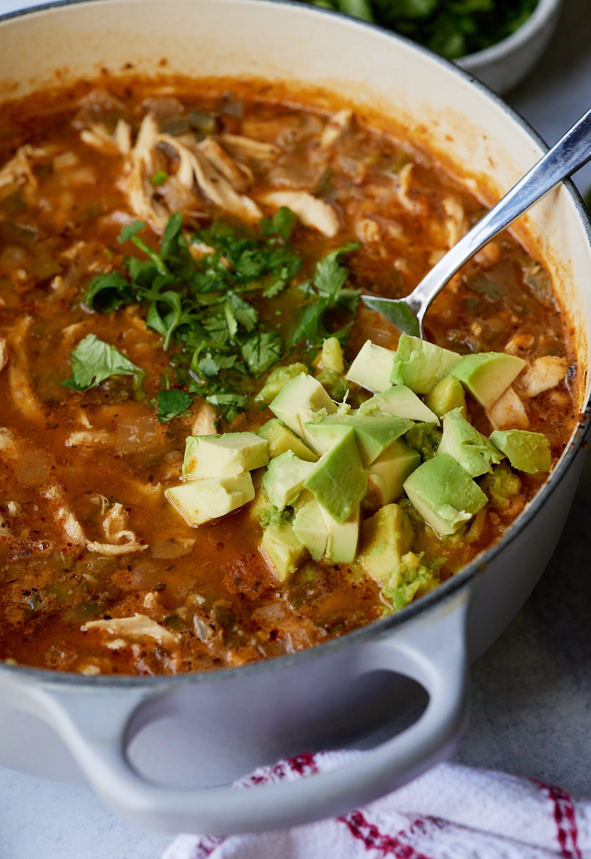 avocado and cilantro on top of chili