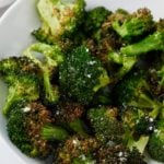 Air fryer broccoli served in a white bowl.