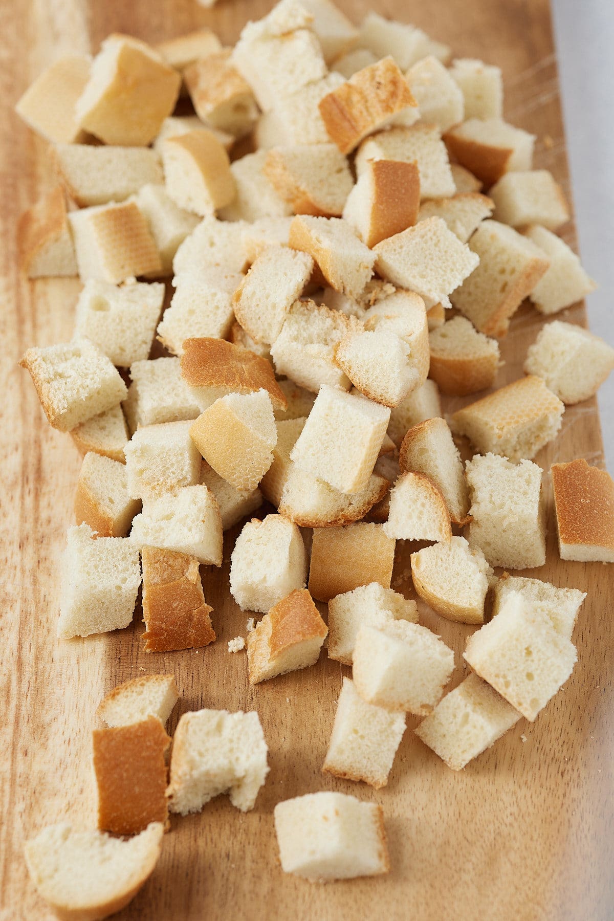 A bread loaf cut into cubes.