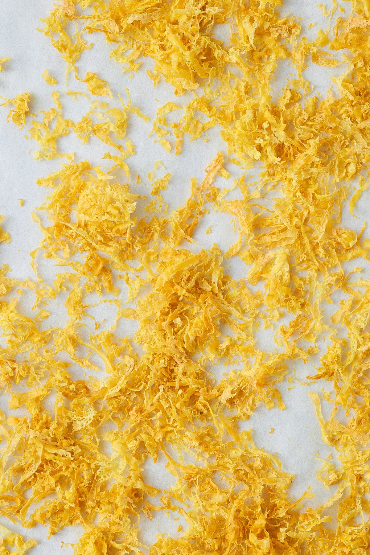 Lemon zest on a baking sheet.