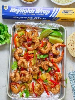 jamaican jerk shrimp in sheetpan lined with foil and reynolds wrap