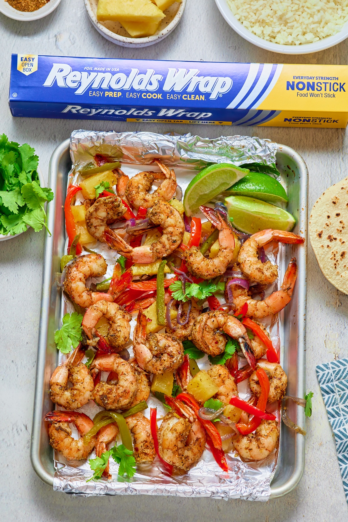 jamaican jerk shrimp in sheetpan lined with foil and reynolds wrap