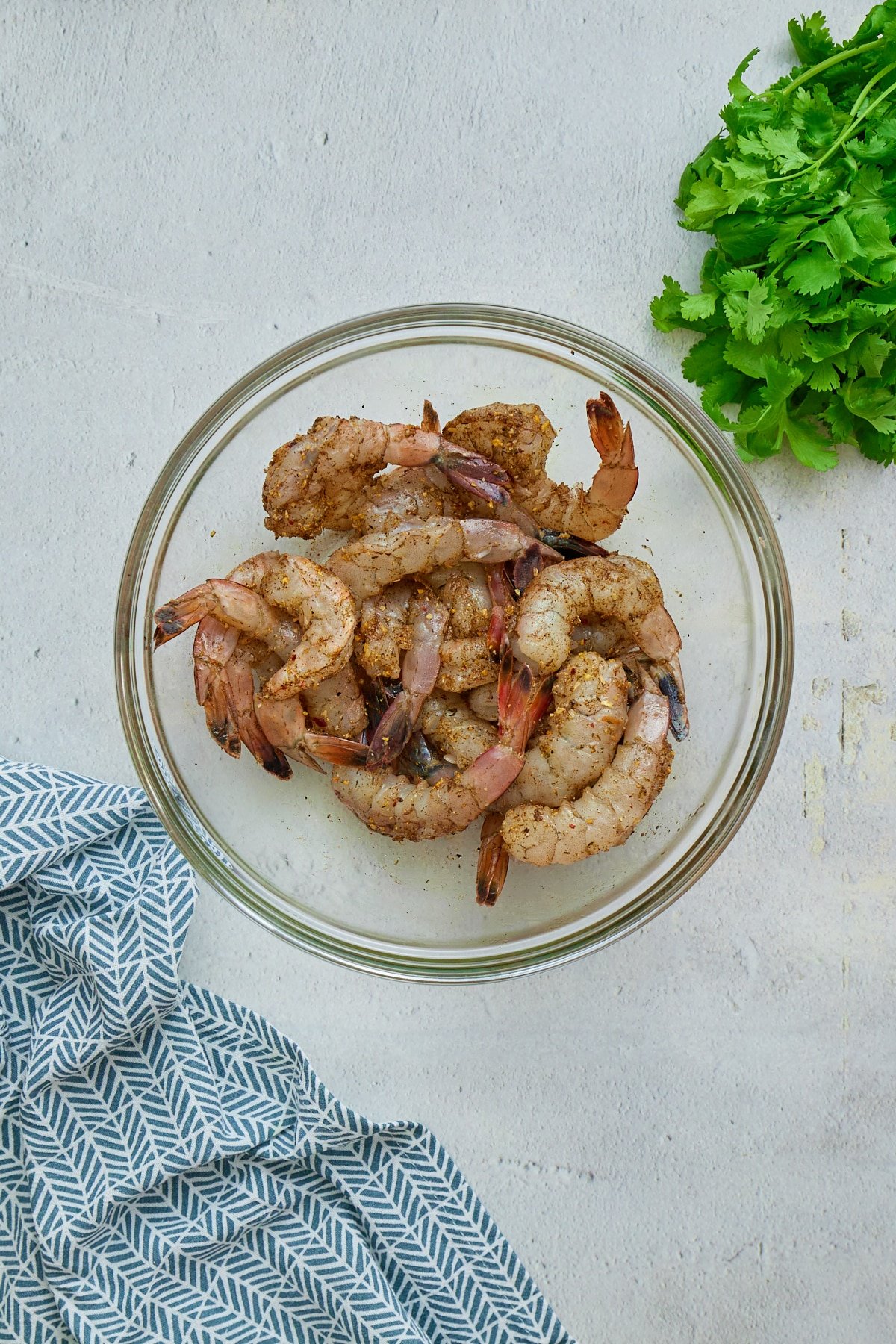 shrimp marinating in glass bowl