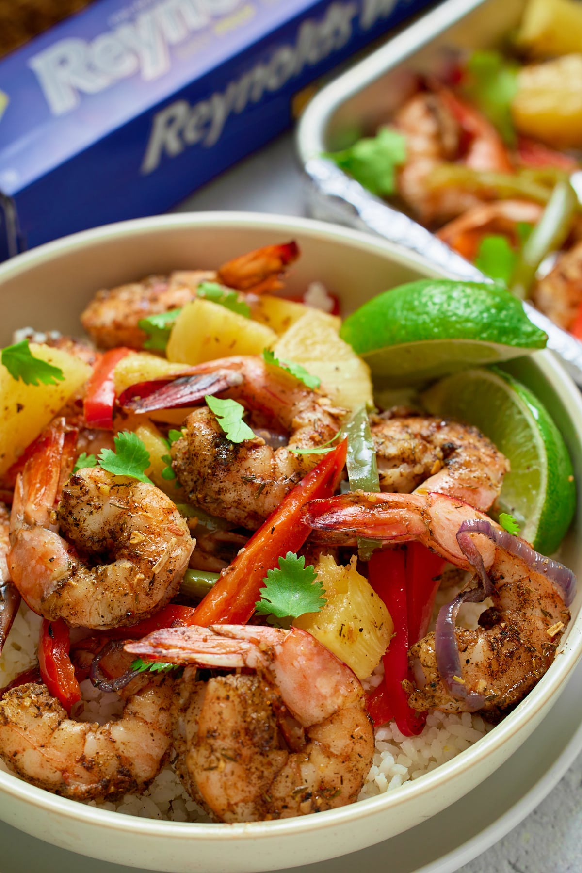 jamaican jerk shrimp in bowl on top of rice