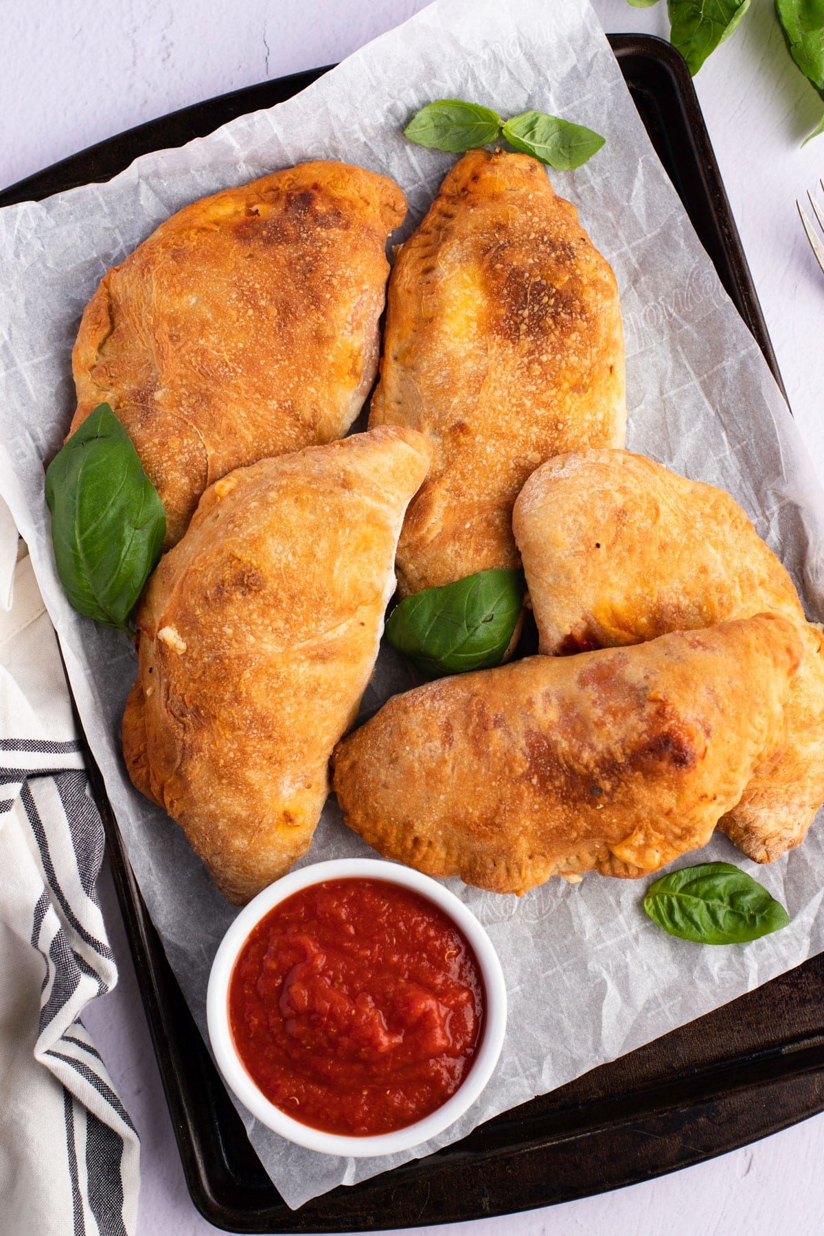 air fryer calzones on baking sheet