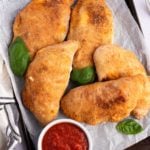 air fryer calzones on baking sheet