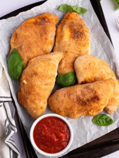 air fryer calzones on baking sheet