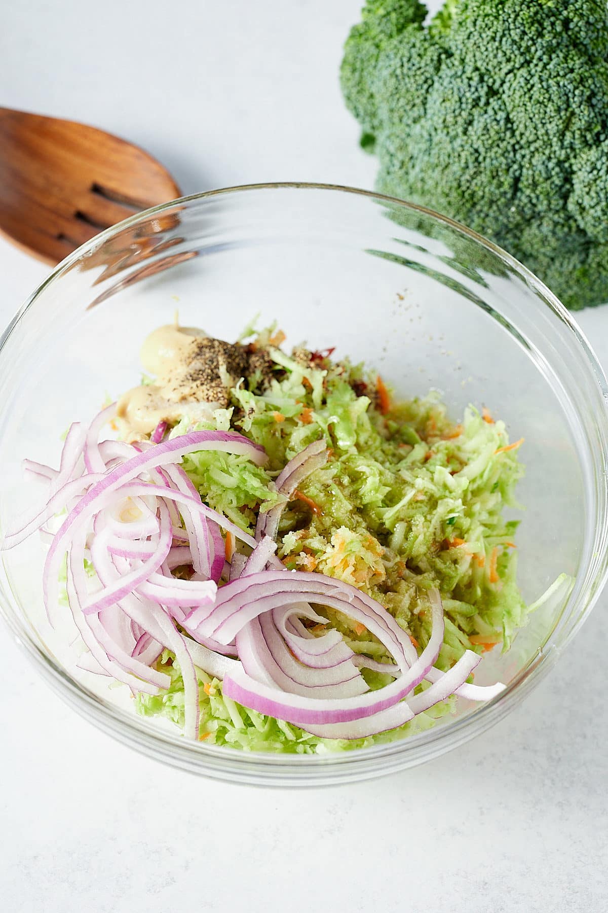 Ingredients for the slaw in a glass bowl.