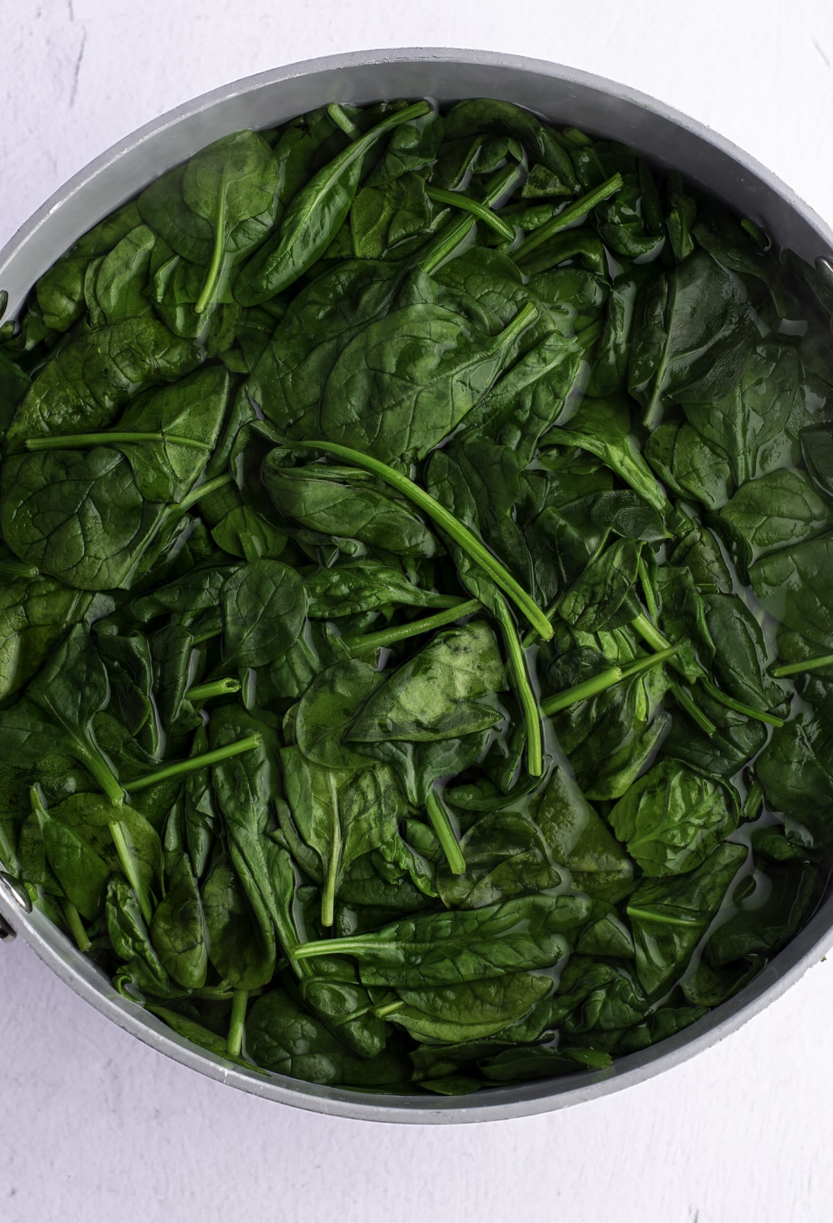 Wilted spinach in a bowl.