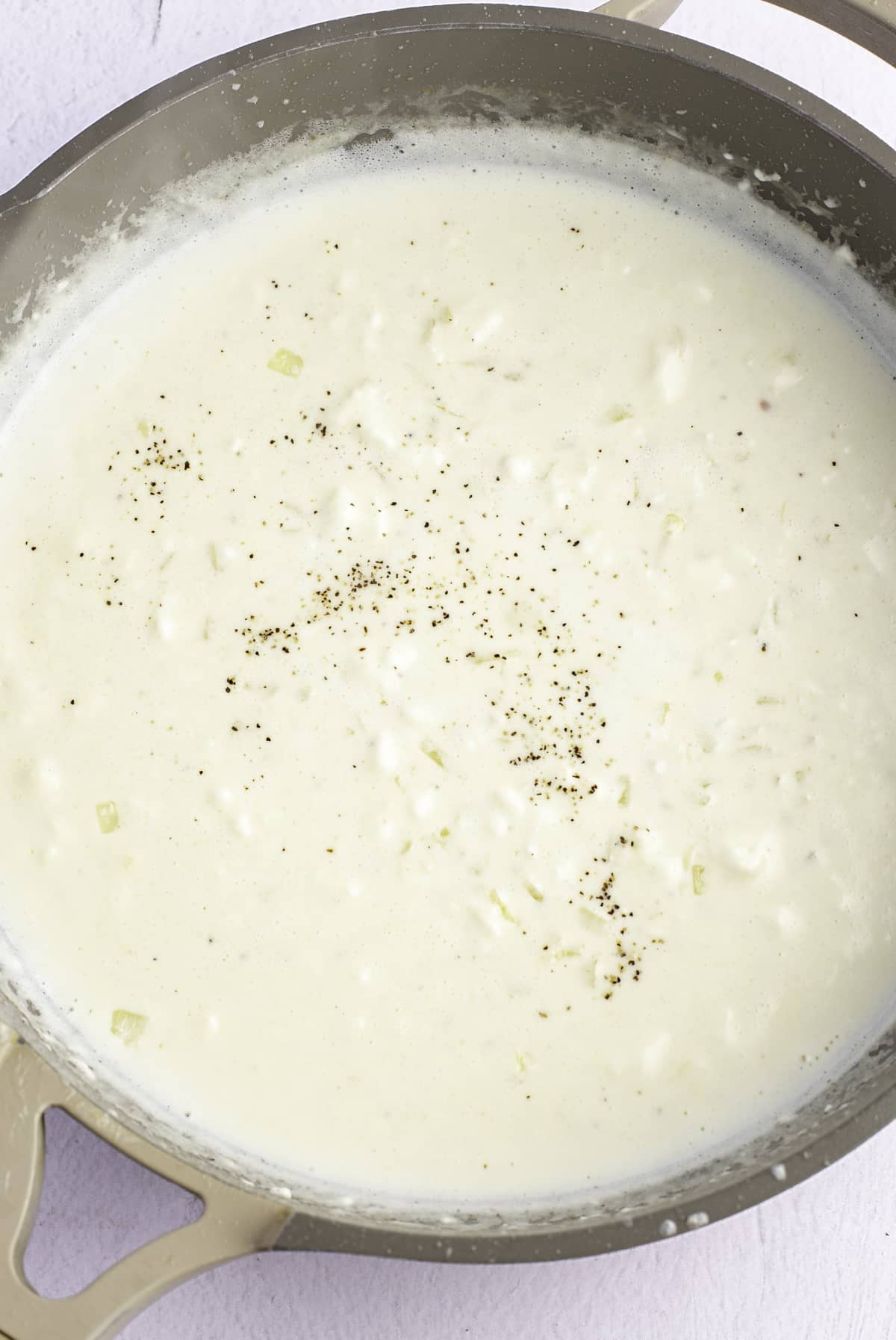 Cream added to the skillet.