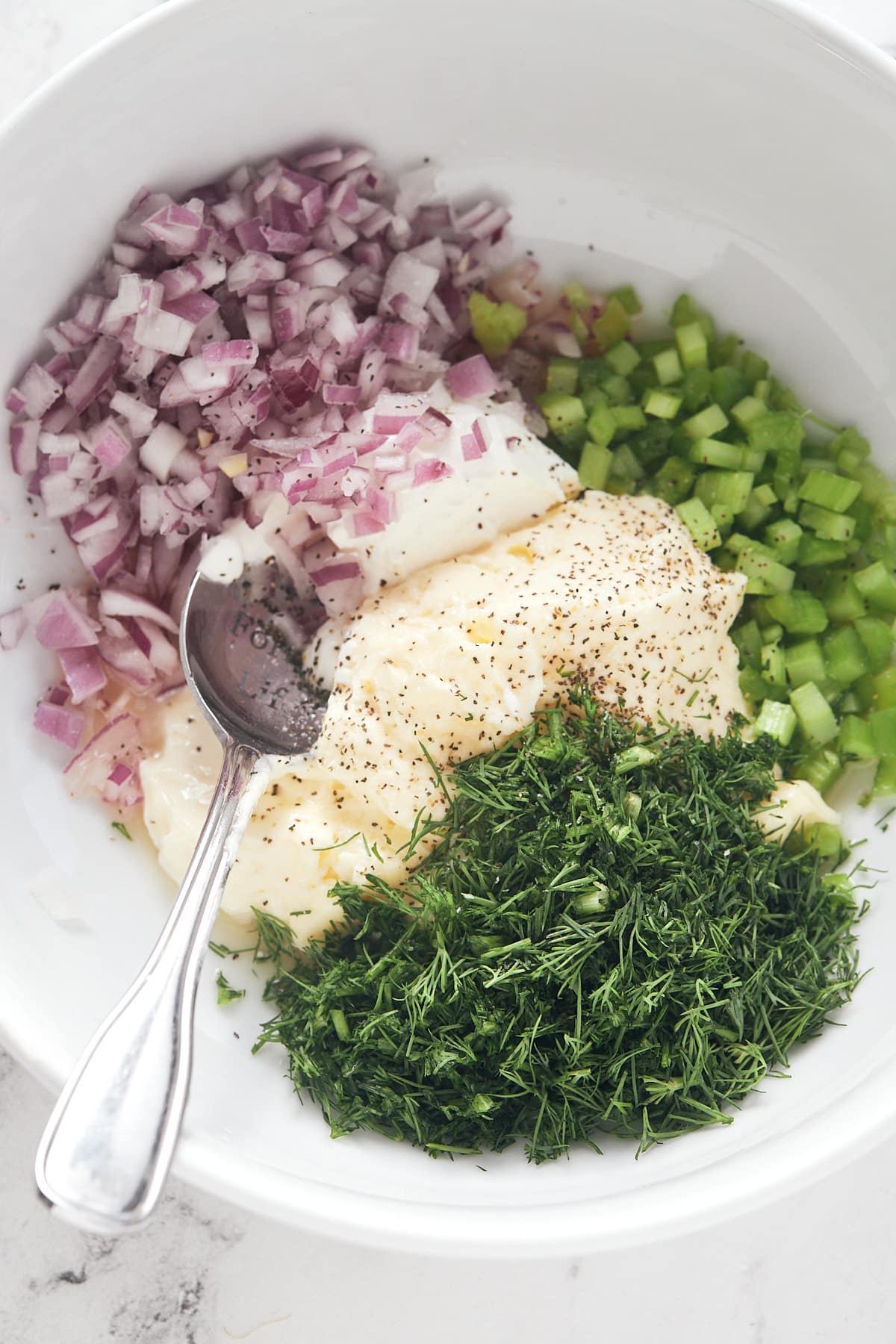 Ingredients for the dressing in a bowl.