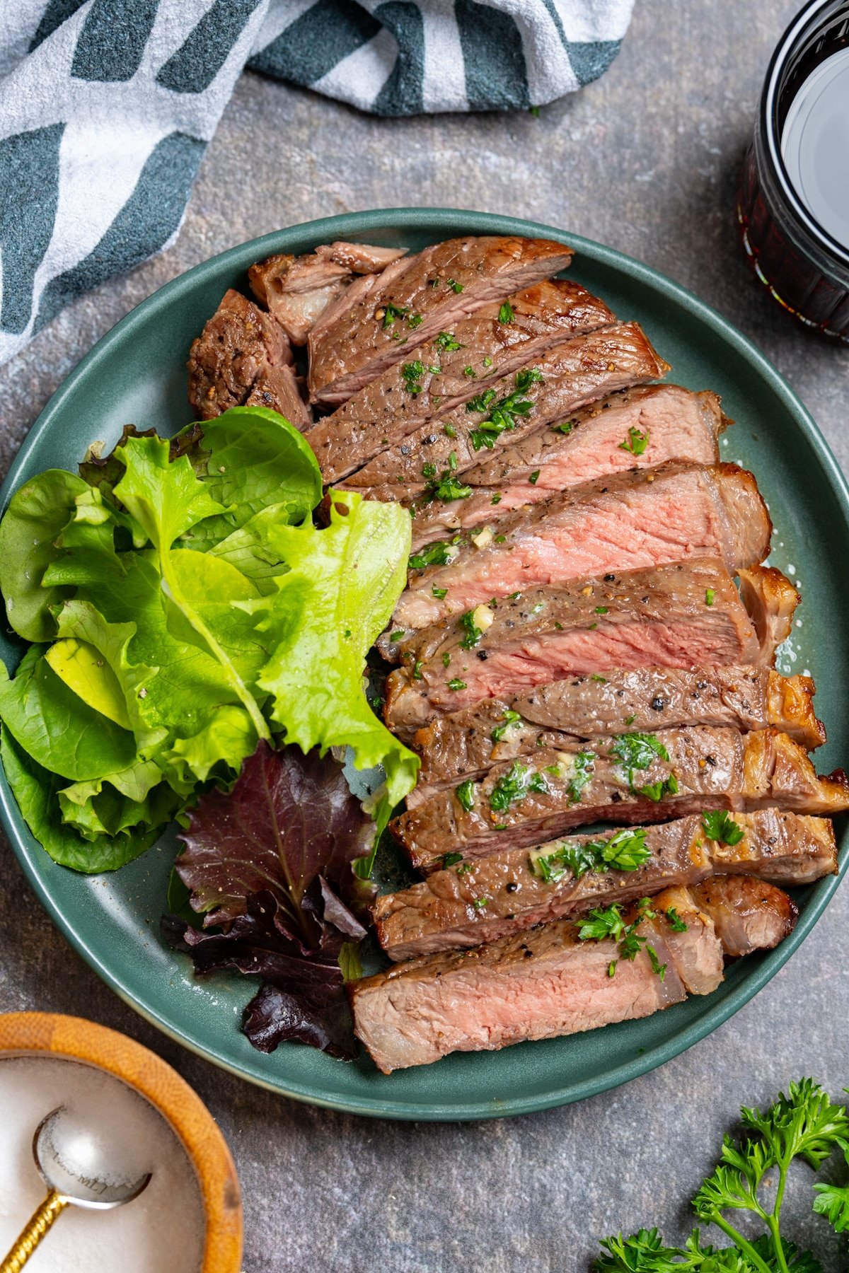 sliced ribeye steak on plate