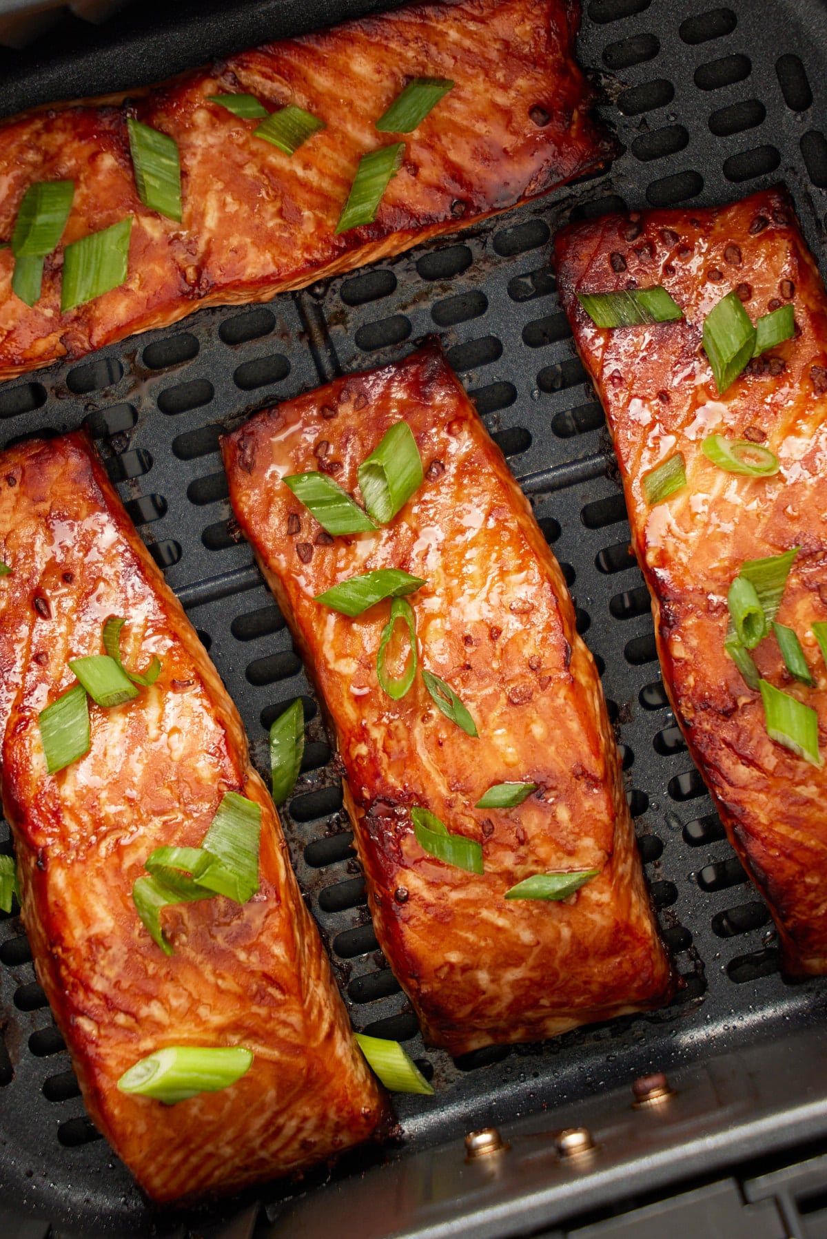 close up photo of salmon in air fryer basket