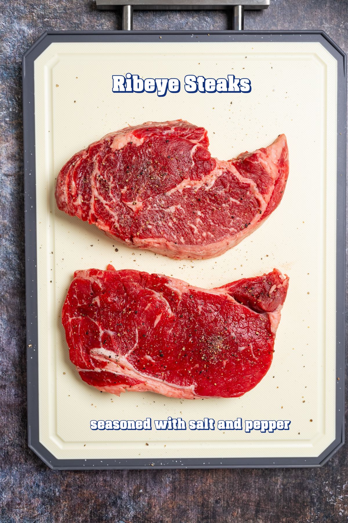 raw ribeye steaks seasoned with salt and pepper