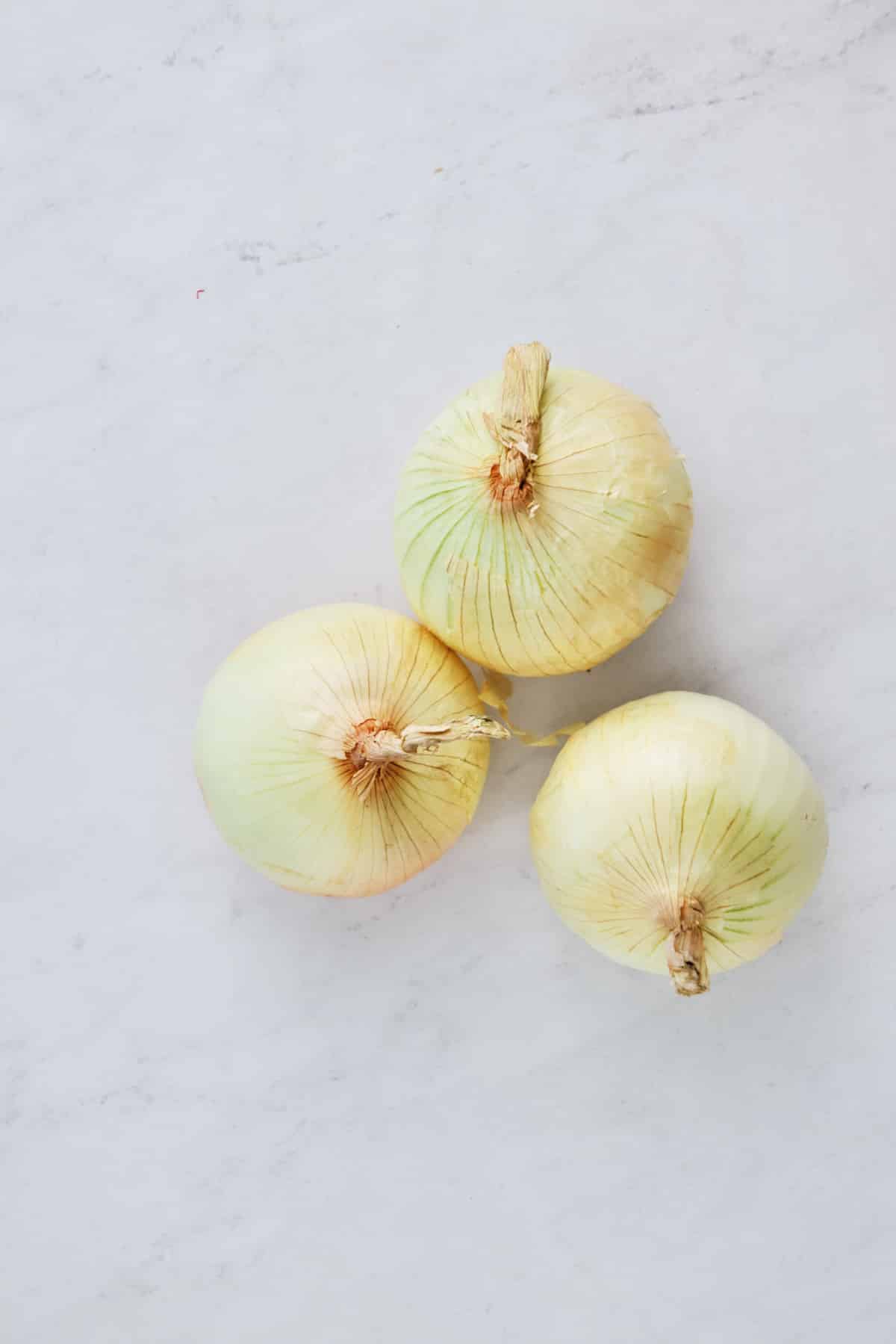 sweet onions on white background