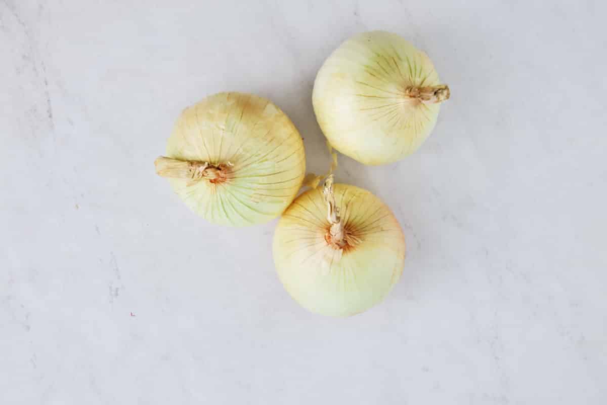 sweet onions on white background