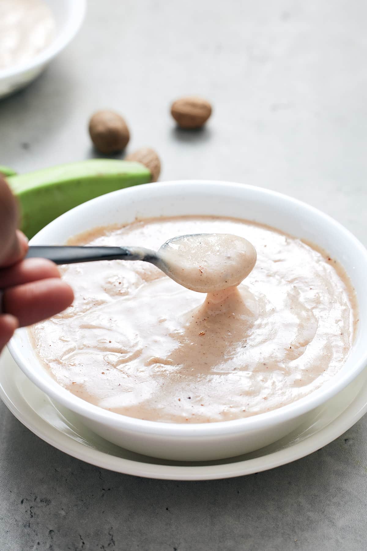 spoon lifting porridge out of bowl