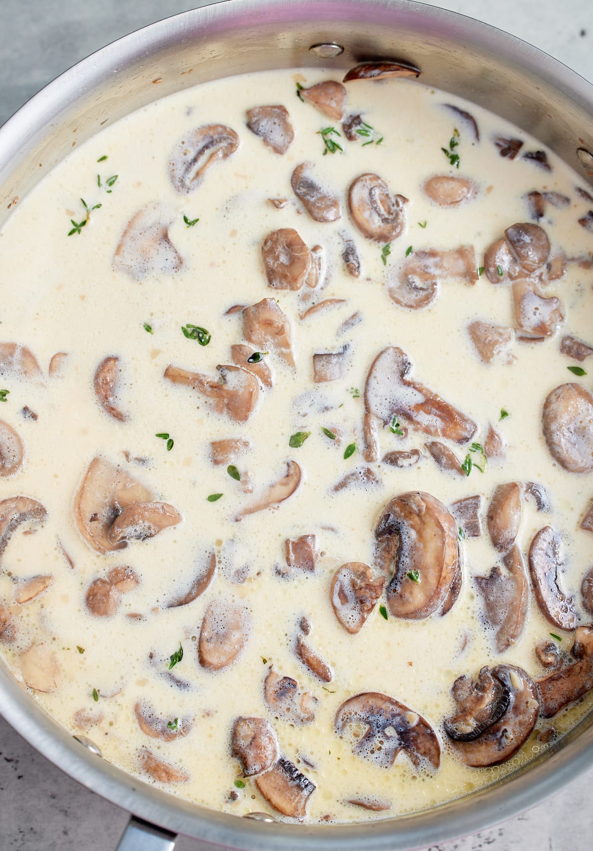 Cream added to the mushrooms.