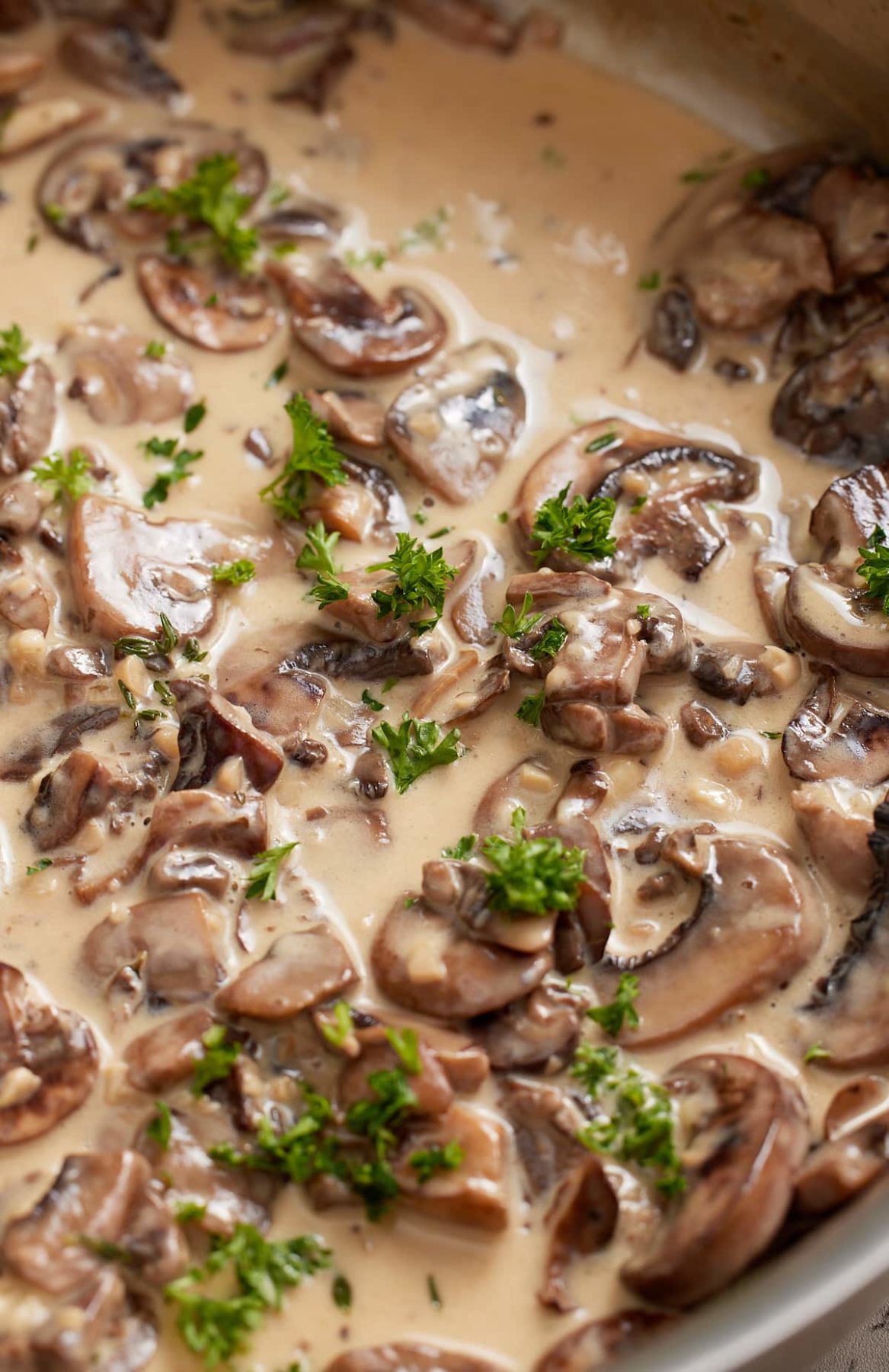 Close up of the finished mushroom sauce with fresh parsley.