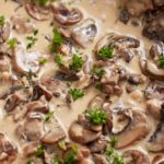 Close up of the finished mushroom sauce with fresh parsley.