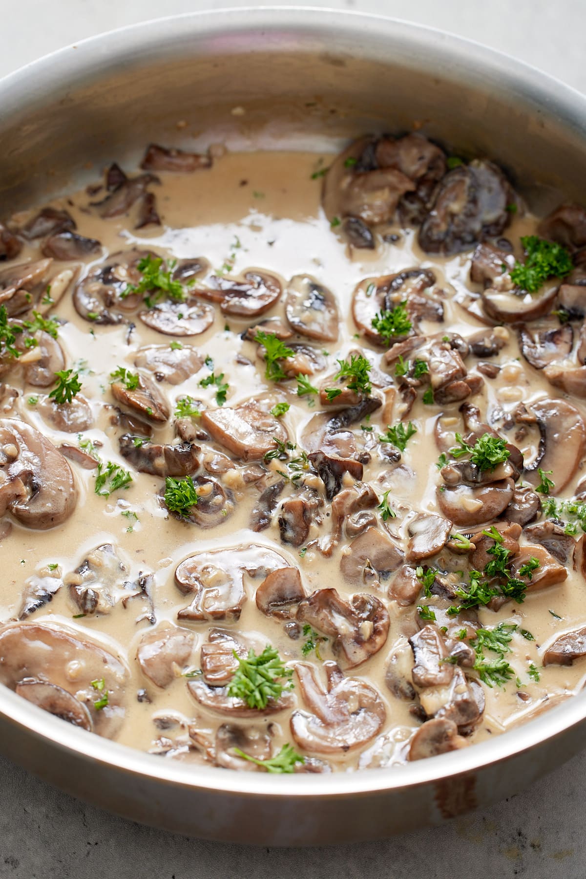 Sliced mushrooms in a creamy sauce.