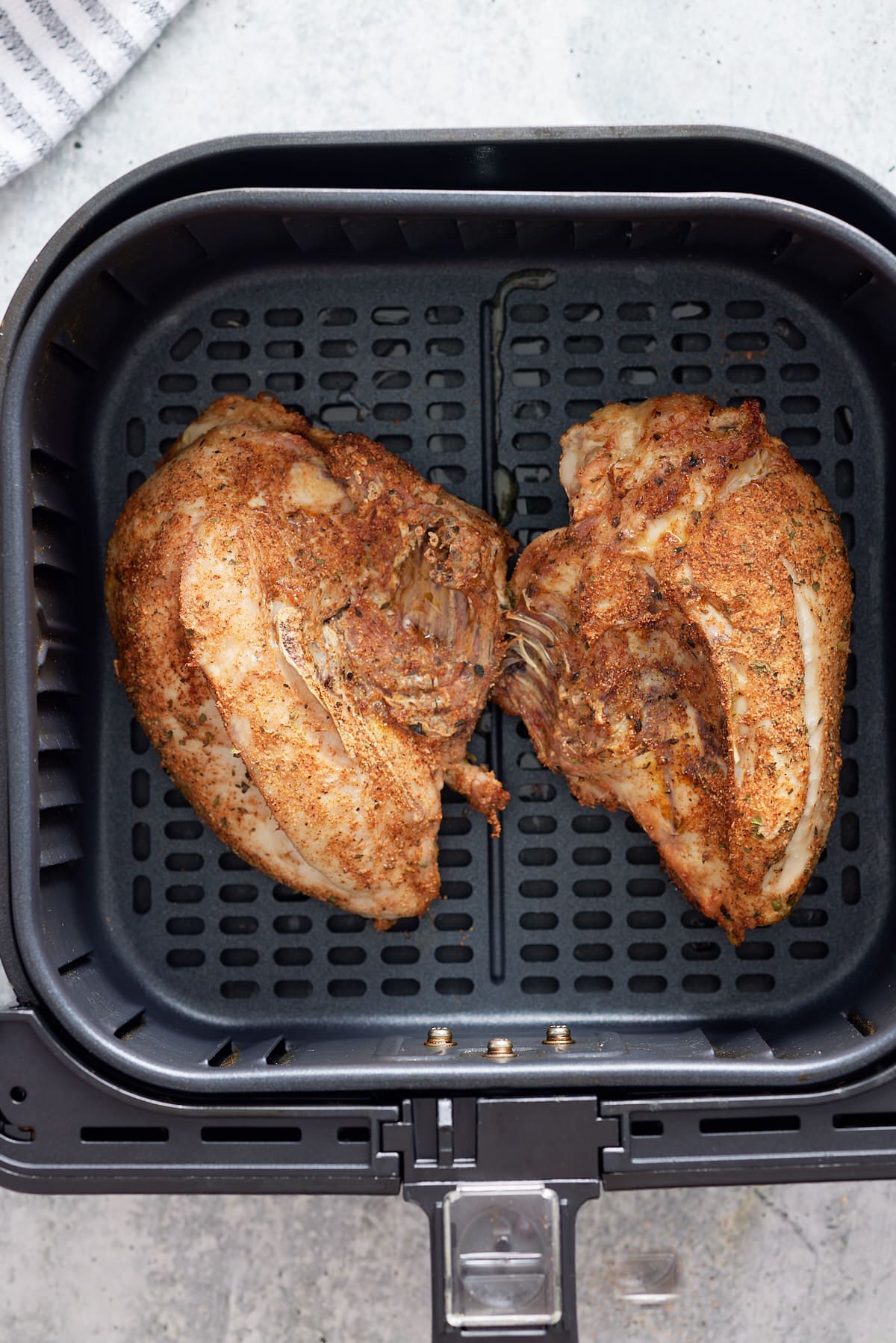 bone-in chicken breasts in air fryer basket