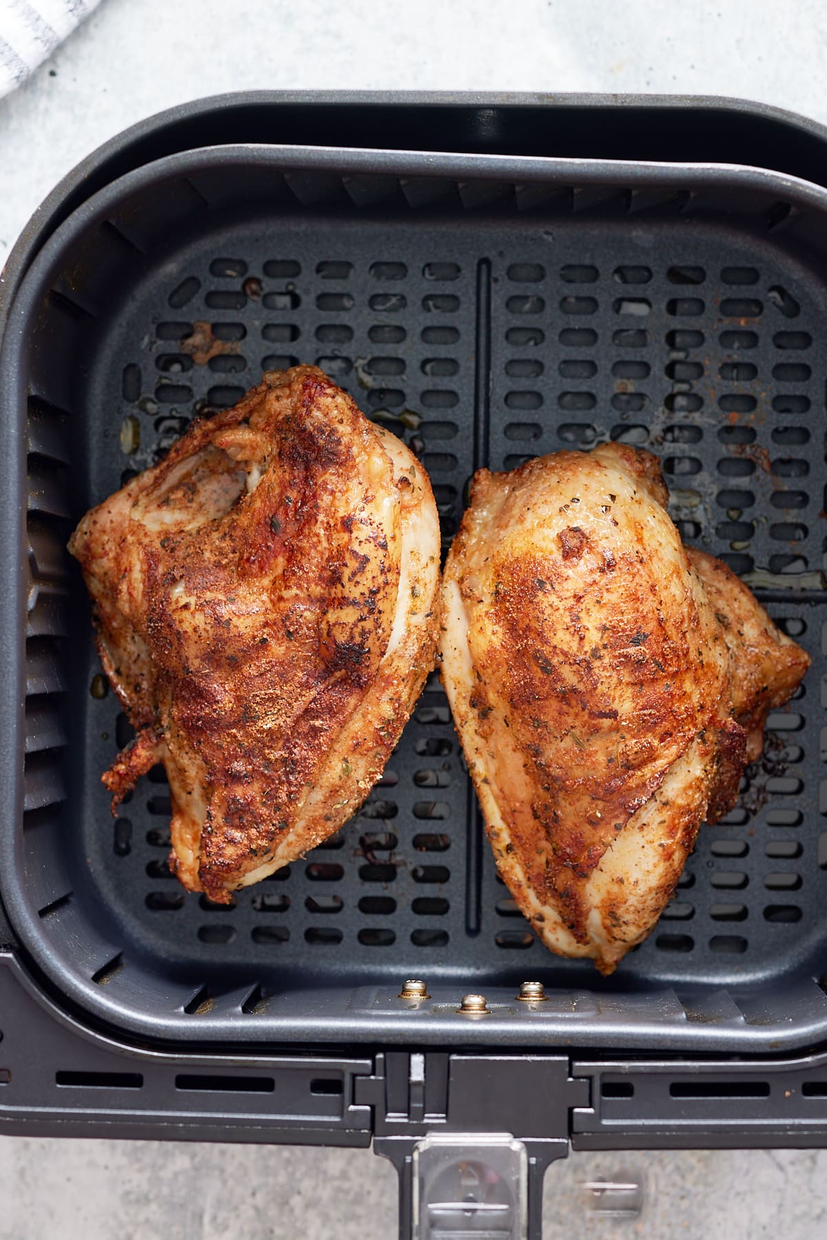 cooked bone in chicken breasts in air fryer basket