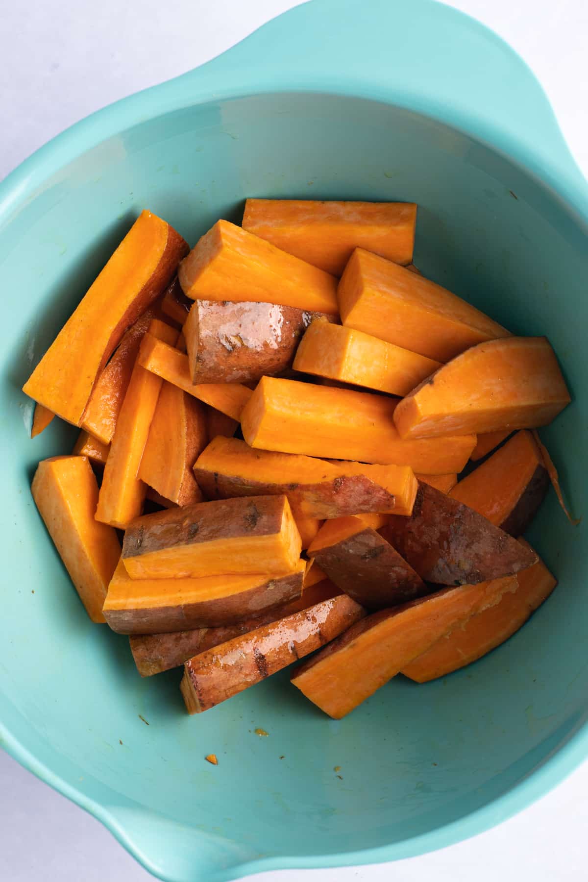 Sweet potato wedges in a bowl.