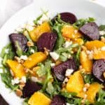 text that says beet and orange salad with photo of beet and orange salad