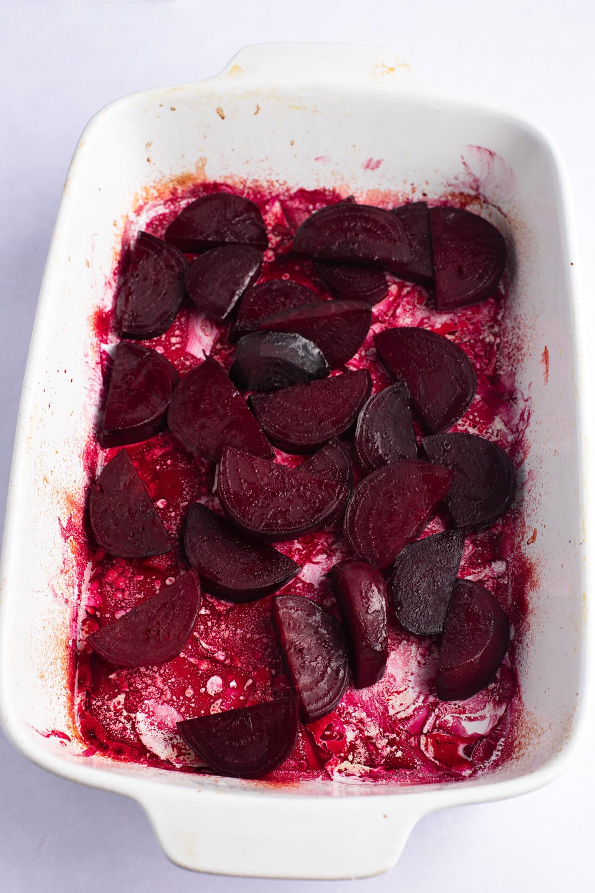 Roasted beets in a baking dish.